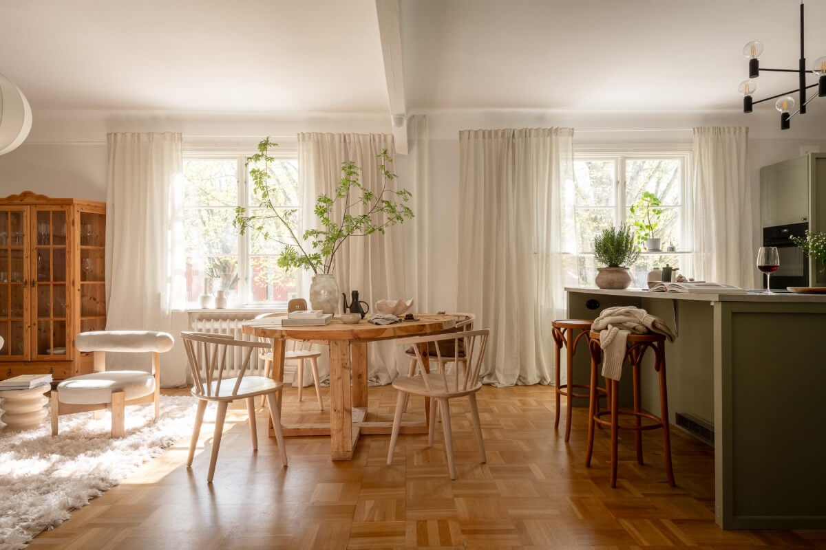 A Cozy Swedish Apartment with a Walk-In Pantry in the Sage Green Kitchen 1 open plan living room green kitchen parquet floor