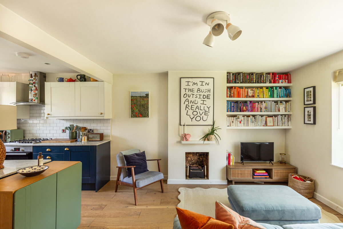 open-plan living space kitchen bookshelves