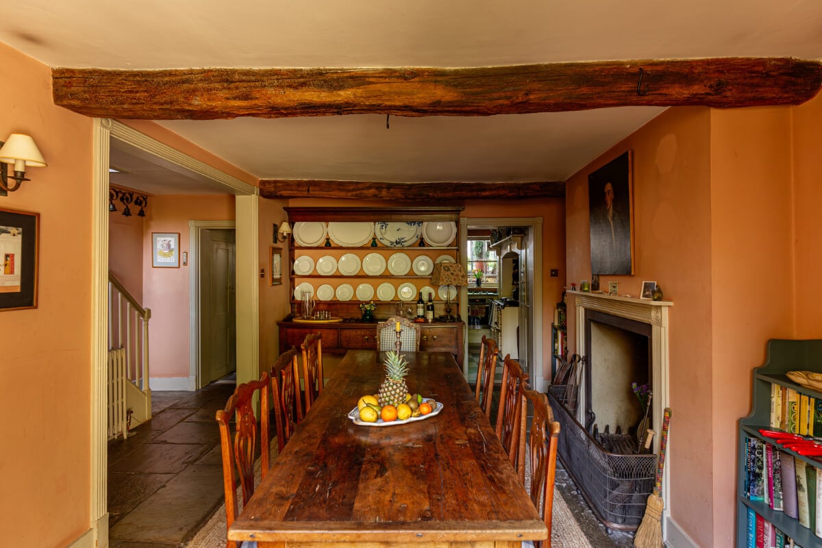 A Carefully Restored Georgian Townhouse in East London 11 orange dining room exposed wooden beams