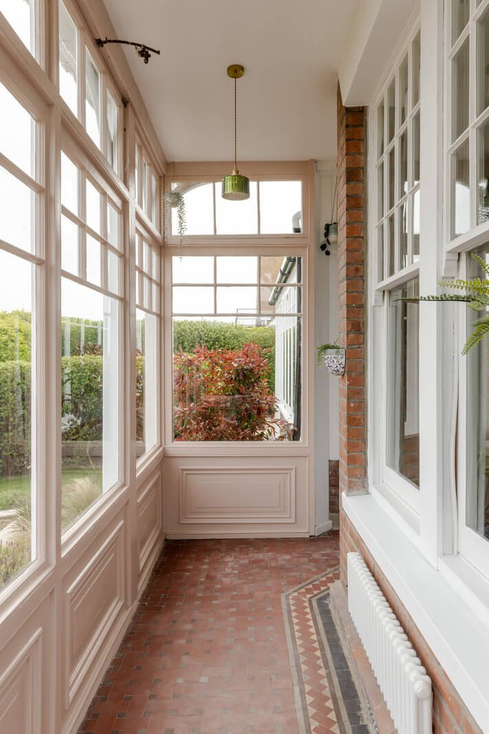 A Grand Edwardian Villa with a Yellow Kitchen and Coastal Views 15 passageway stone floor