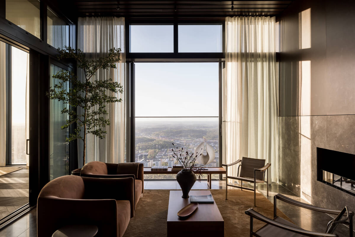A Luxurious Three-Storey Penthouse in Sweden’s Tallest Residential Tower 10 penthouse sitting room fireplace