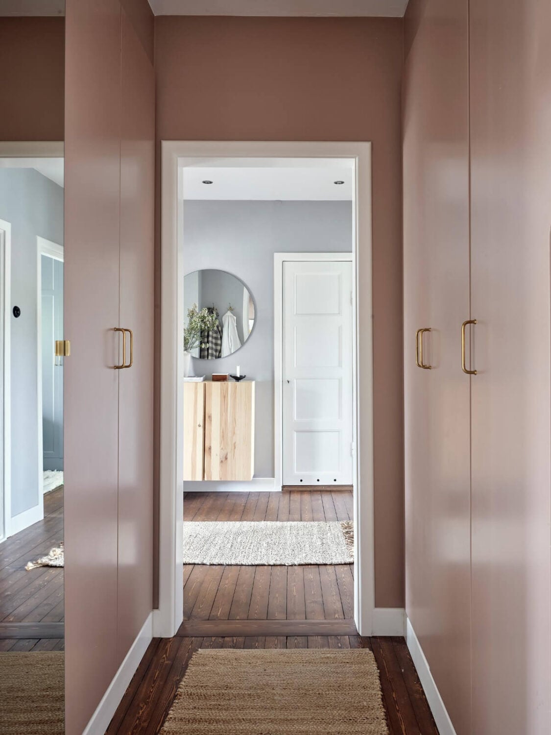 A Harmonious Color Palette in a Swedish Duplex Apartment 31 pink hall with wardrobes A Harmonious Color Palette in a Swedish Duplex Apartment