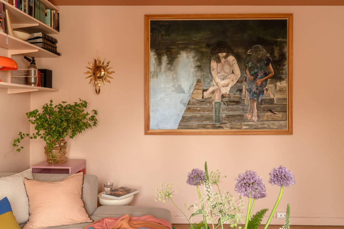 A Stylish and Joyful Color and Material Palette in a Midcentury Apartment 7 pink living room large artwork