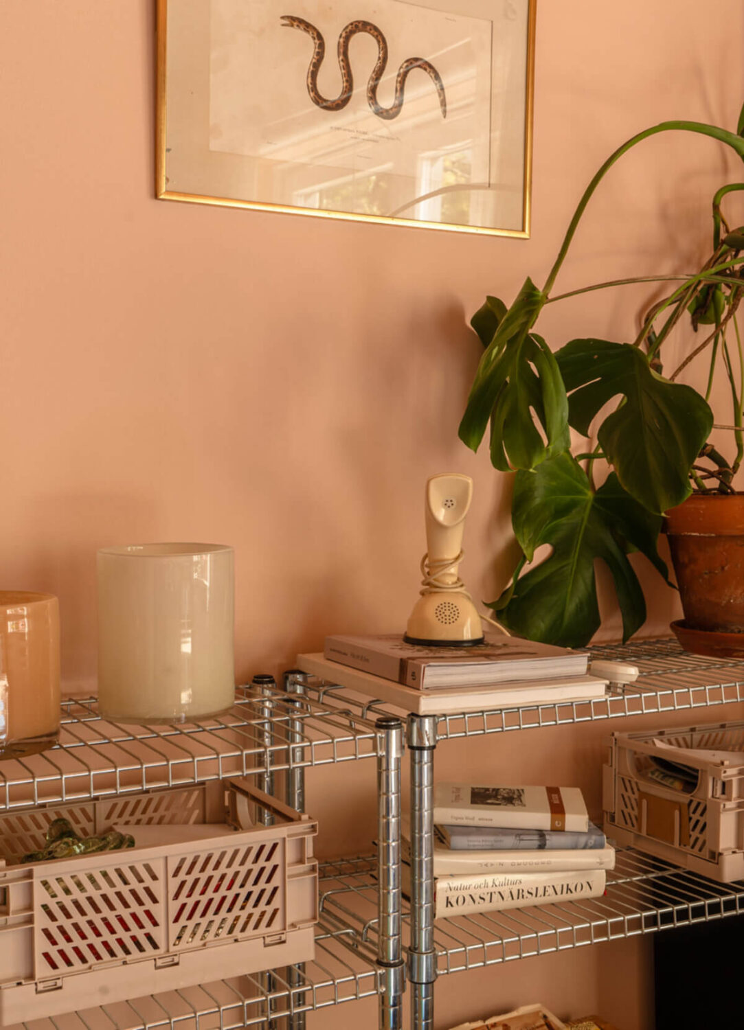 A Stylish and Joyful Color and Material Palette in a Midcentury Apartment 5 pink living room open cabinets