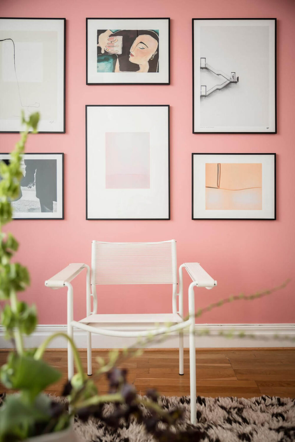 A Teal Green Living Room and Large Windows in a Swedish Apartment 23 pink paint gallery wall