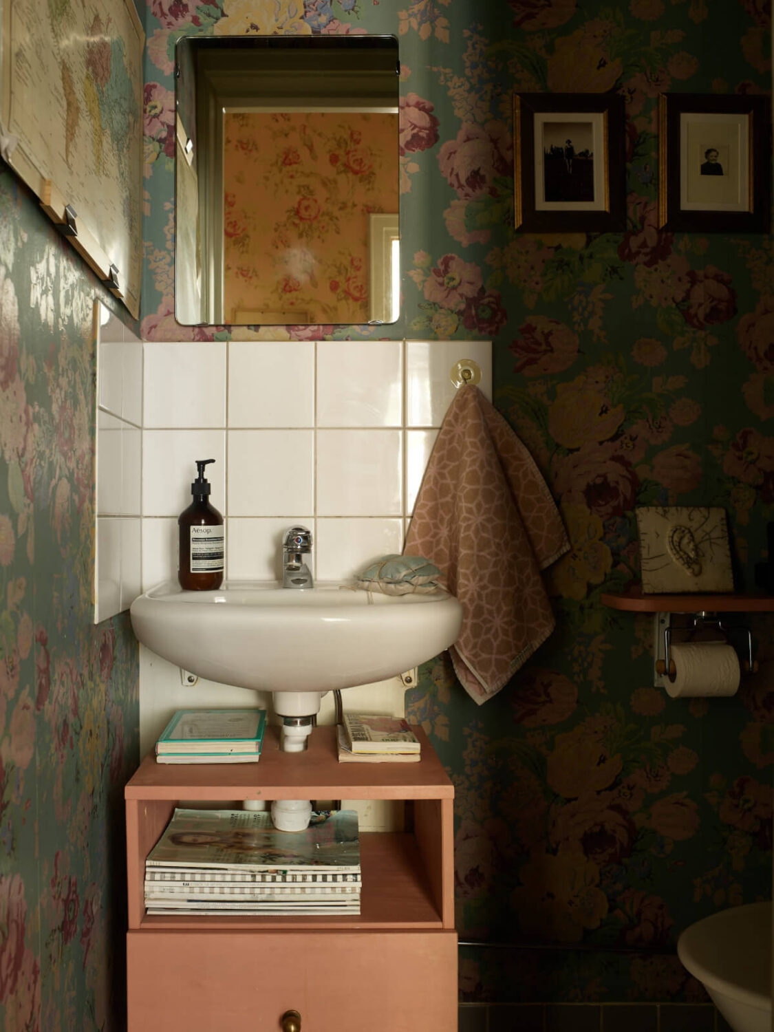 Wallpapers and a Midcentury-Style Kitchen in a 1930s Apartment 28 powder room floral wallpaper pink cabinet