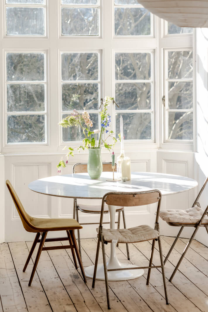 Grand, Light-Filled Spaces in a Gothic-Style English Coastal Home 9 round dining table bay window