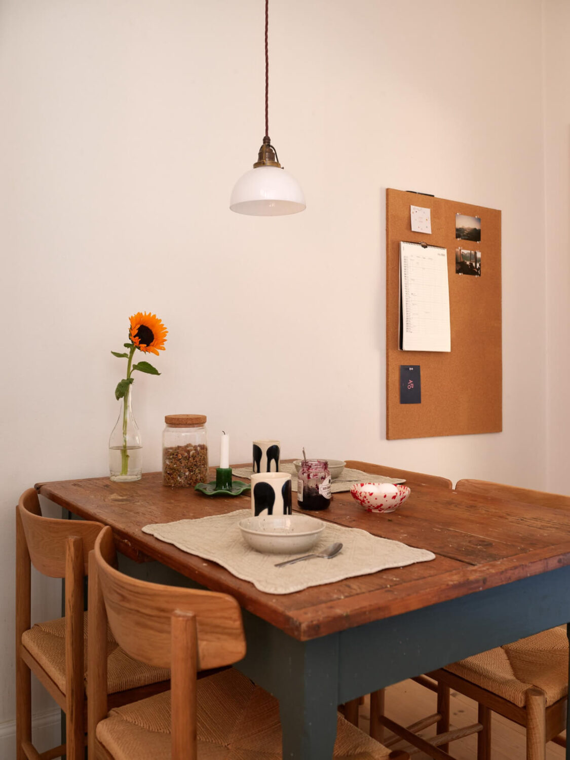 A Light-Filled Stockholm Apartment with Bright Color Pops 18 rustic wooden dining table