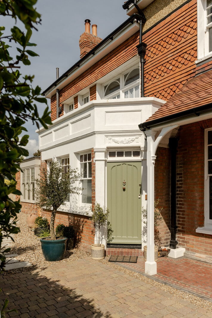 A Grand Edwardian Villa with a Yellow Kitchen and Coastal Views 35 sage green front door