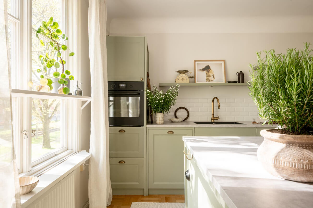 A Cozy Swedish Apartment with a Walk-In Pantry in the Sage Green Kitchen 11 sage green kitchen