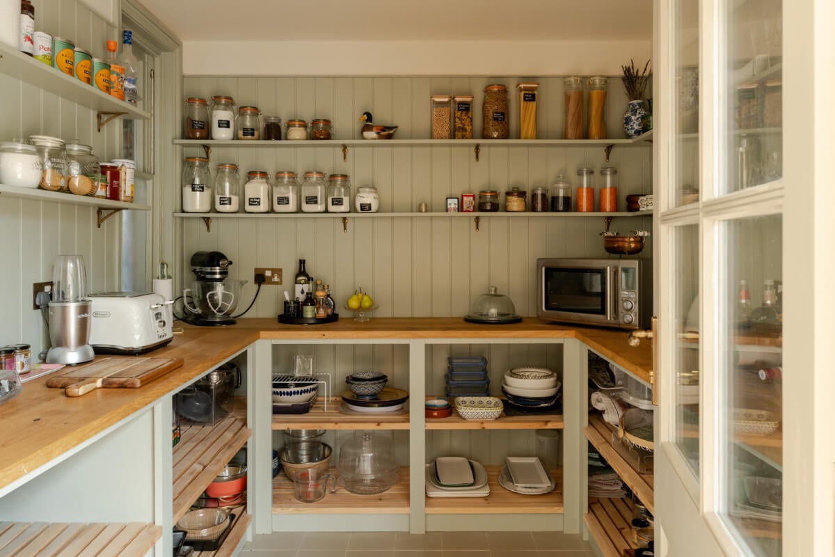 A Grand Edwardian Villa with a Yellow Kitchen and Coastal Views 8 sage green pantry
