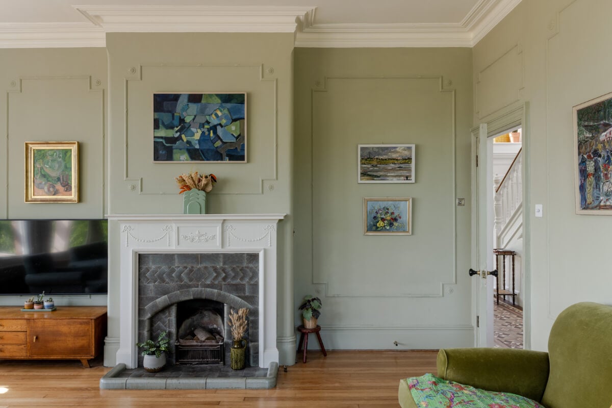 A Grand Edwardian Villa with a Yellow Kitchen and Coastal Views 13 sage green television room