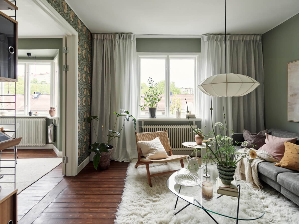 A Harmonious Color Palette in a Swedish Duplex Apartment 9 semi open living space warm wooden floorboards