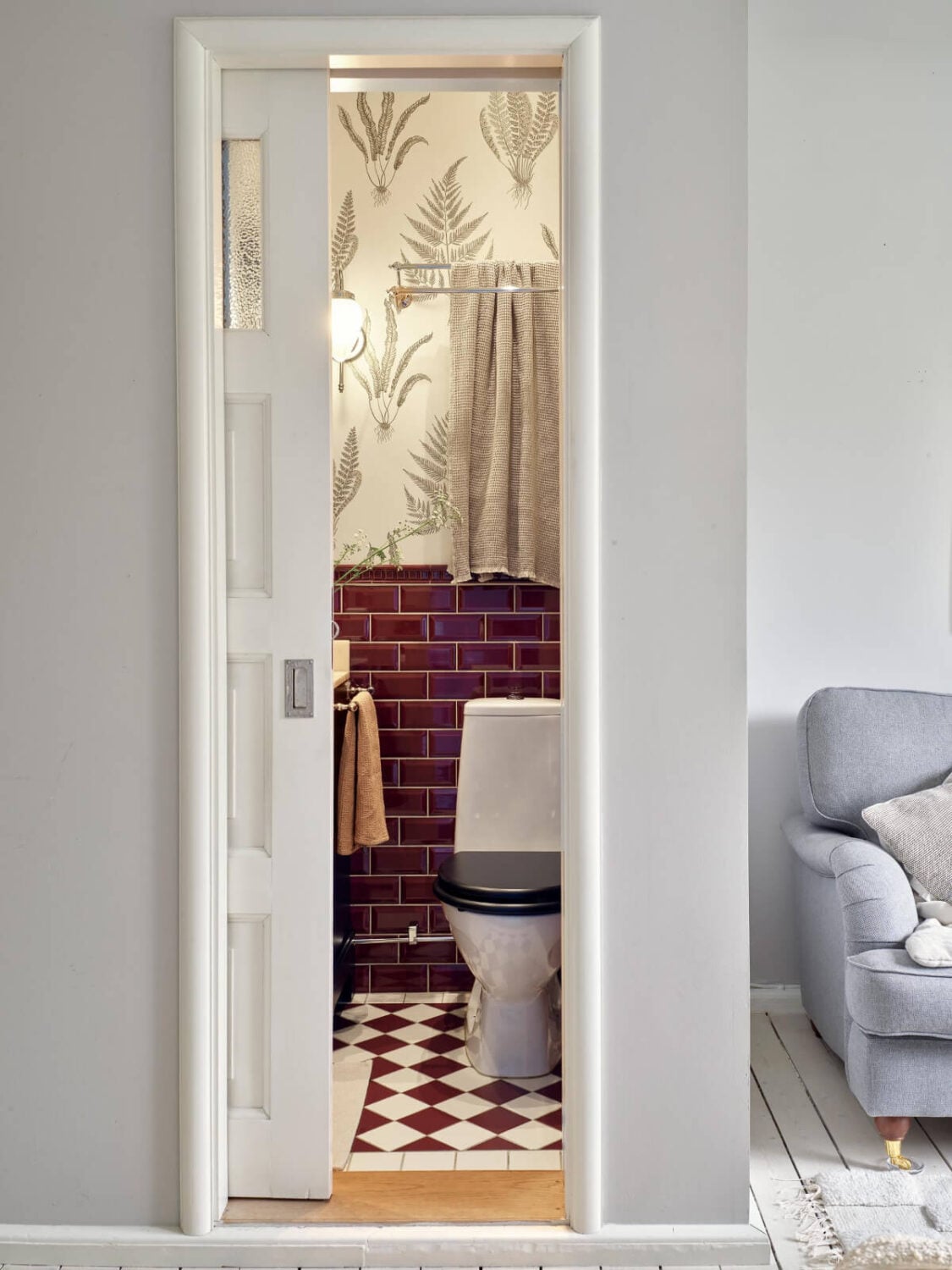 An Apartment with Original Details and a Stunning Period-Style Bathroom 24 sliding door bathroom deep red tiles