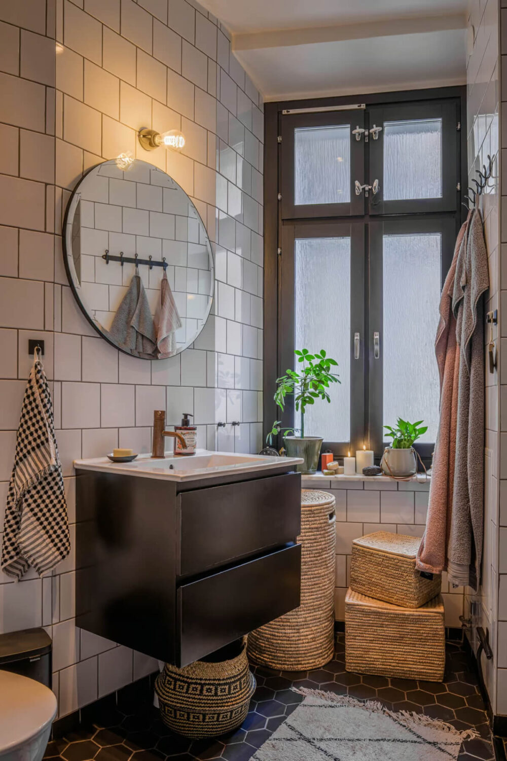 A Spacious One-Bedroom Apartment in Gothenburg 13 small bathroom white tiles black hexagon floor tiles nordroom