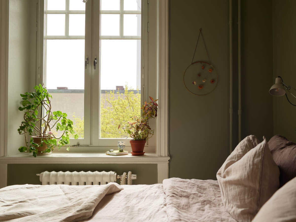 A Beautifully Renovated Early 20th-Century Apartment 20 small green bedroom large window