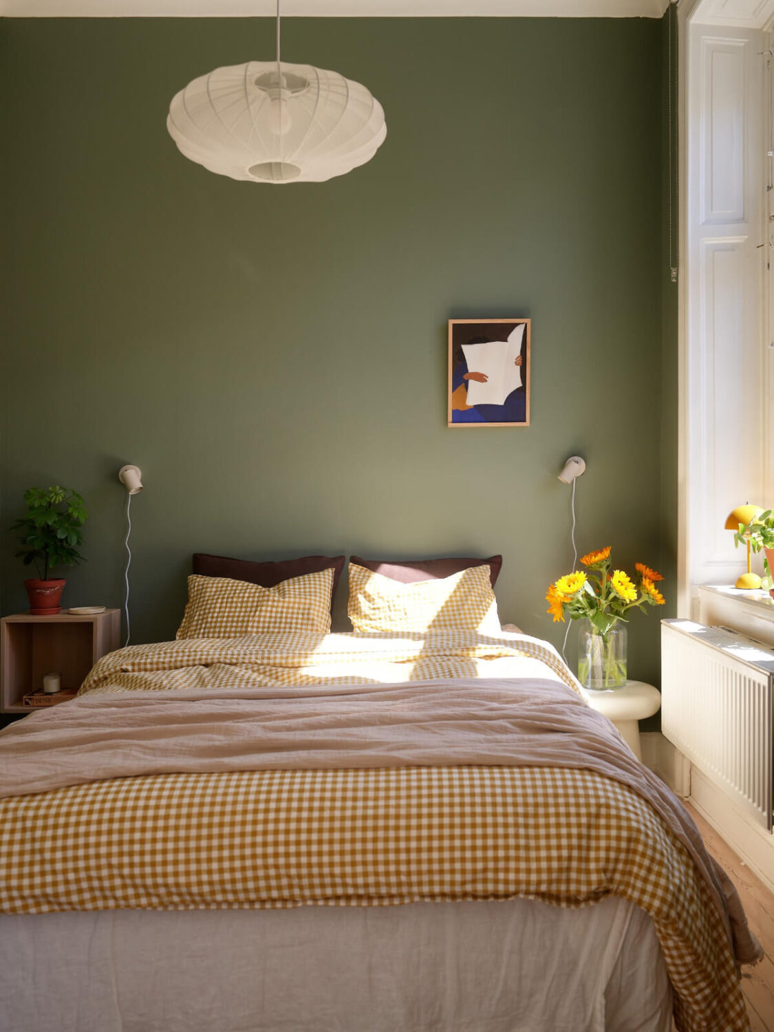 A Light-Filled Stockholm Apartment with Bright Color Pops 12 small green bedroom ochre checkerboard bedding