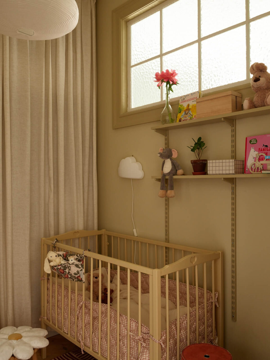 A Light-Filled Stockholm Apartment with Bright Color Pops 16 small nursery inner window