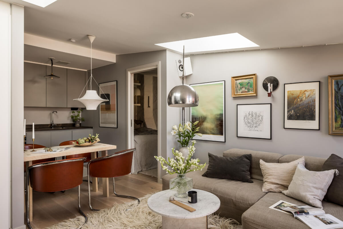 A Small, Cozy Attic Apartment with a Large Terrace 7 small open-plan living space gray walls