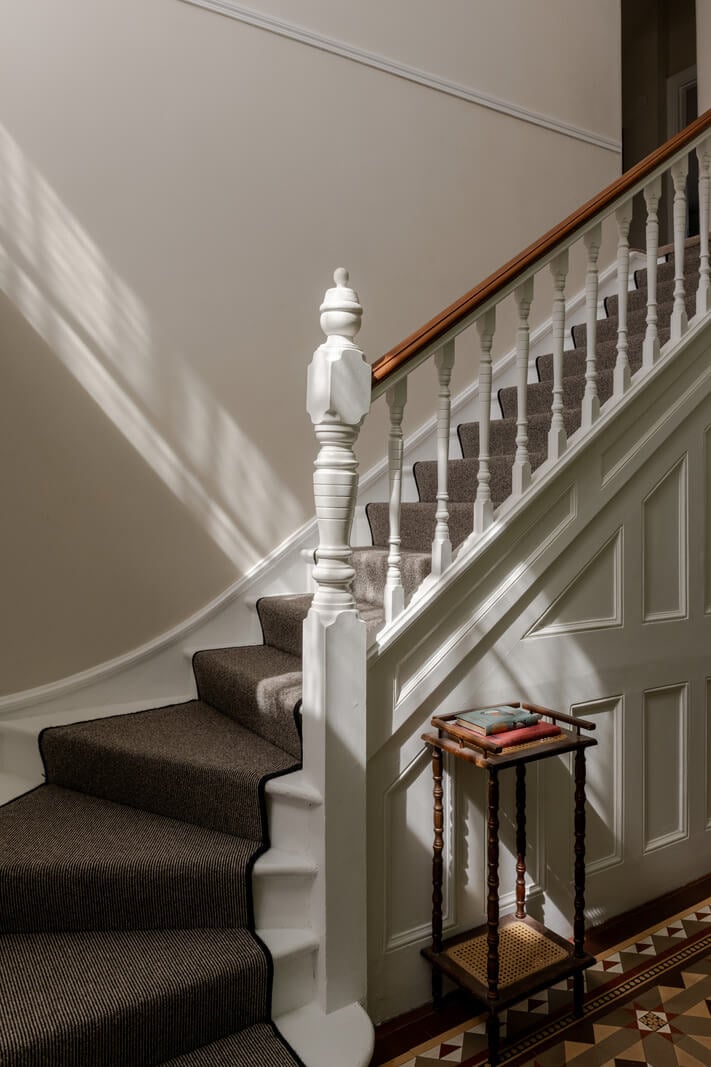 A Grand Edwardian Villa with a Yellow Kitchen and Coastal Views 19 staircase