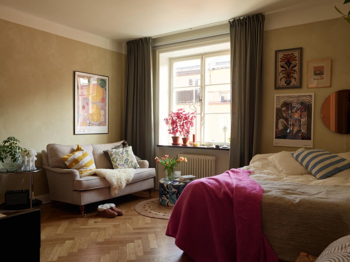 Warm Walls and Original Elements in a Swedish Studio Apartment 1 studio apartment earthy tones herringbone floor