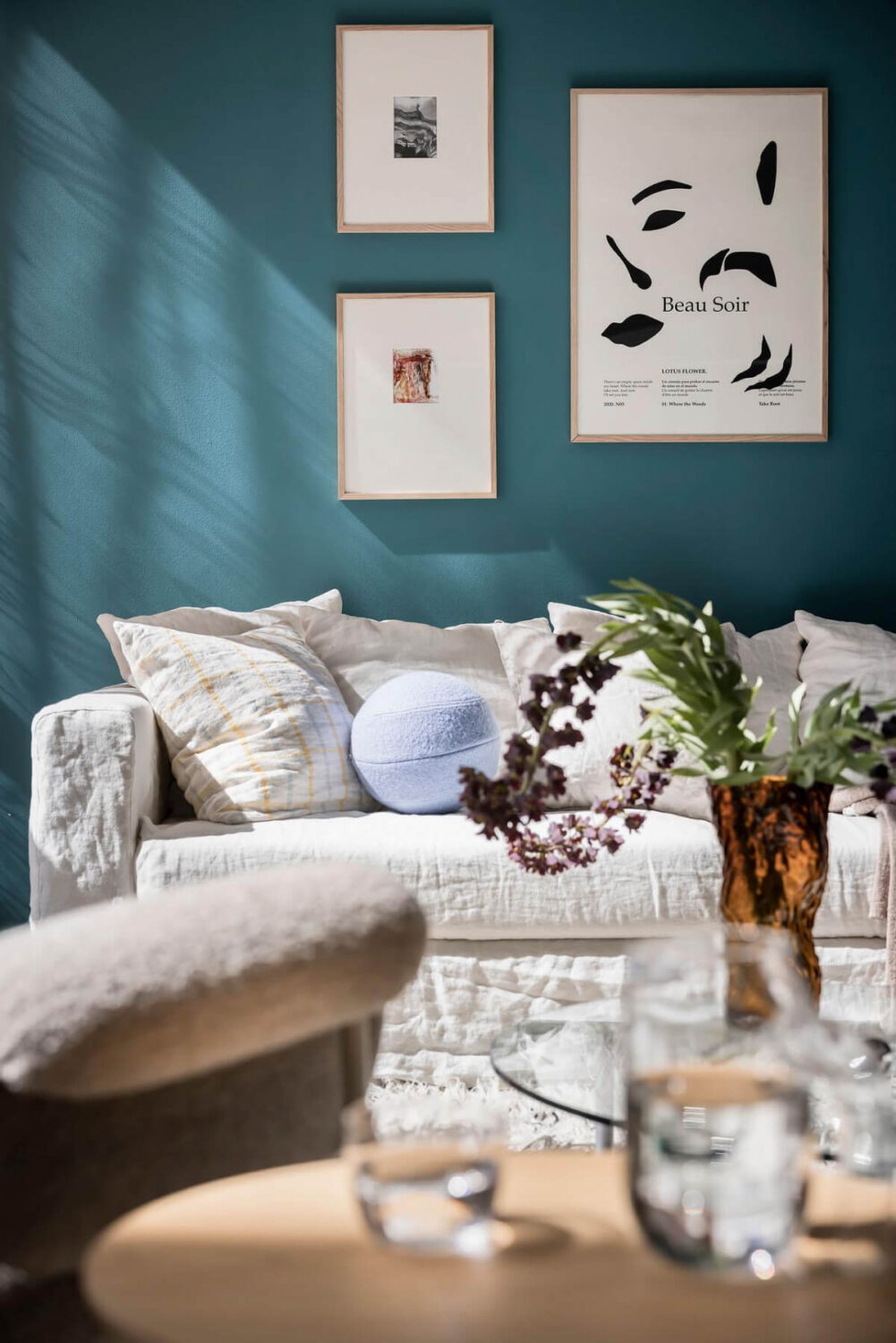 A Teal Green Living Room and Large Windows in a Swedish Apartment 4 teal green wall living room detail
