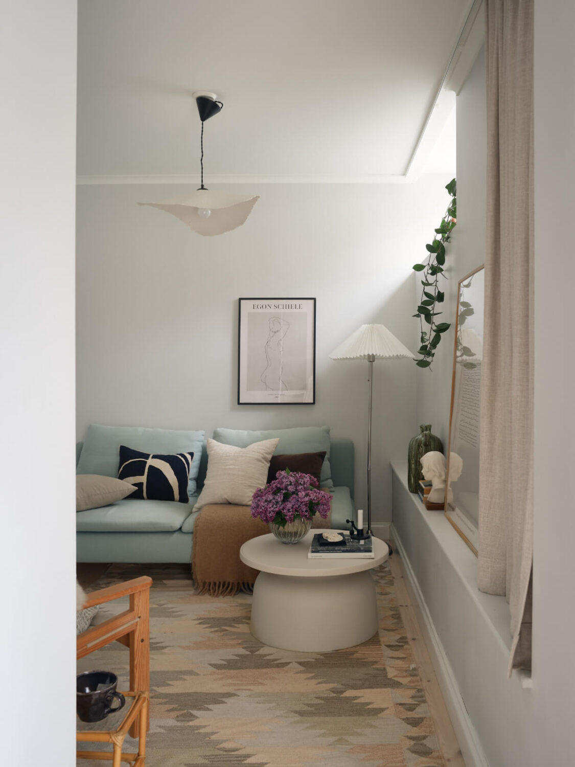A Stylish Basement Apartment with a Private Terrace 16 tiny living room large rug high window