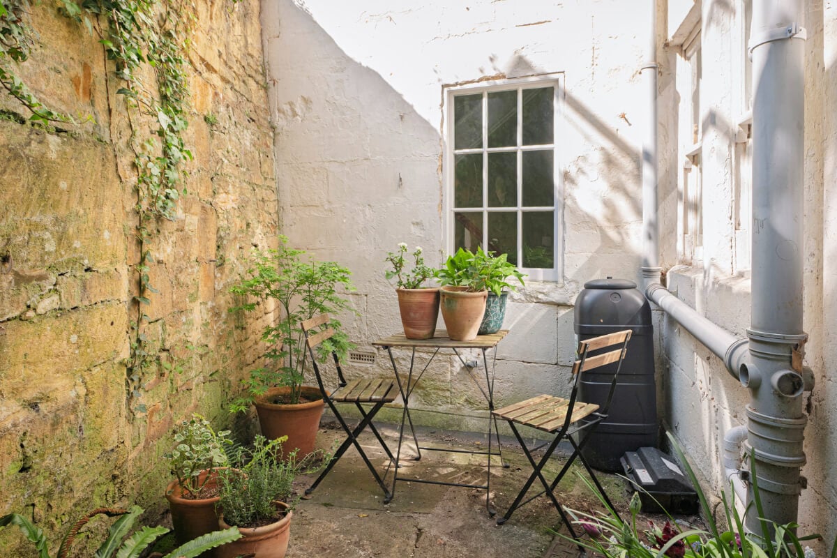 A Family Home with a Cheerful Color Palette in a Historic House 25 tiny walled garden