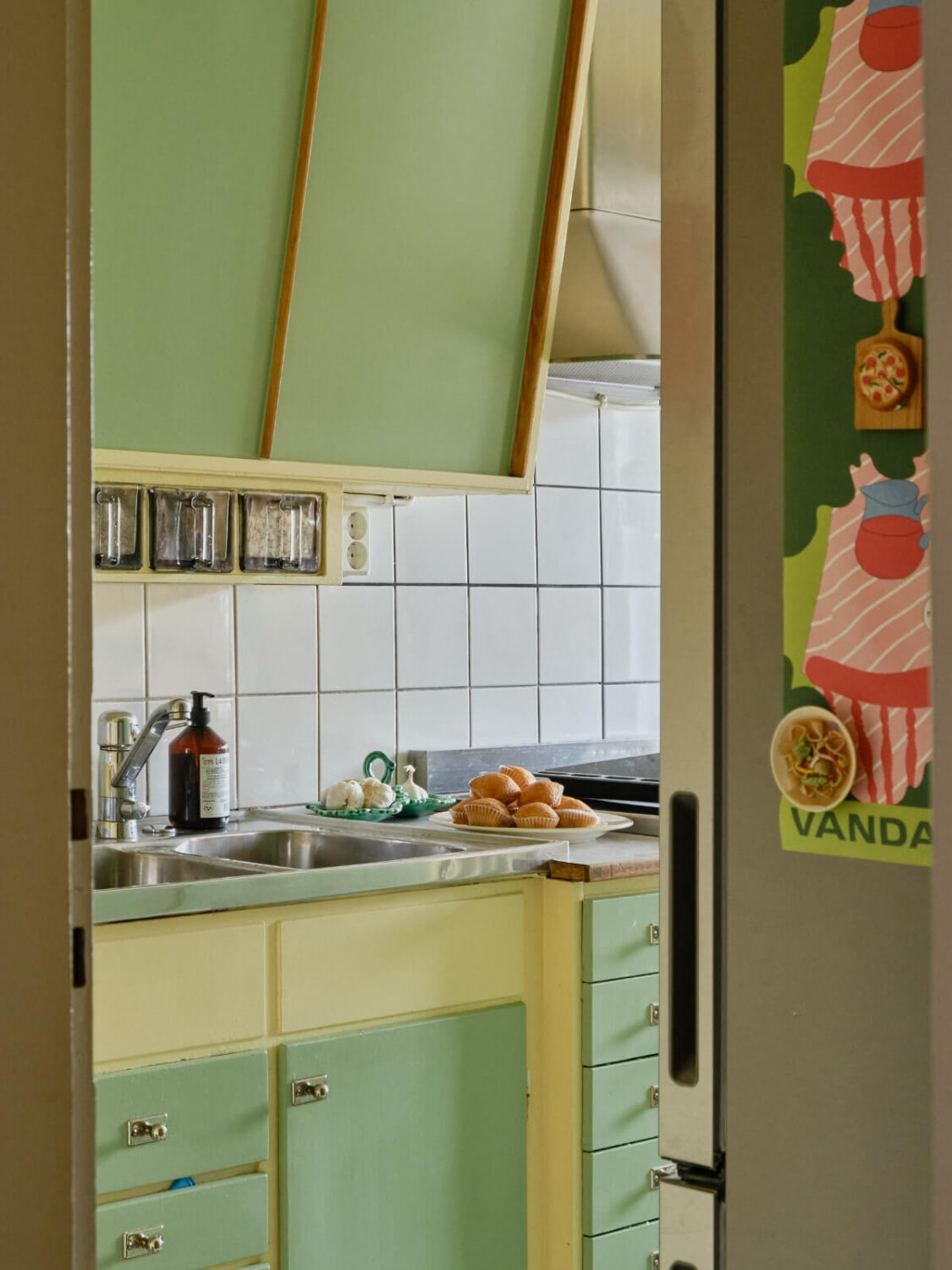 A Colorful 1940s Apartment with Original Elements 18 view into midcentury kitchen