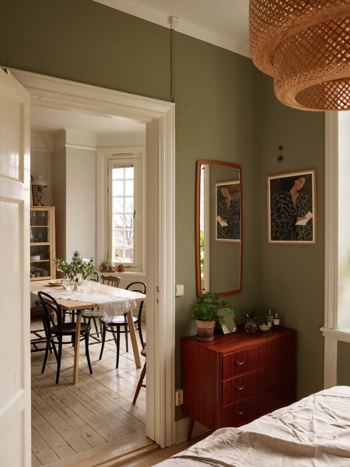 A Beautifully Renovated Early 20th-Century Apartment 21 vintage dresser green bedroom