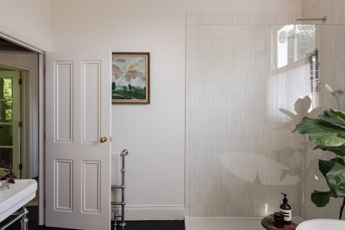 Contemporary and Classic Design in a Two-Bedroom London Duplex 19 walk in shower light vertical tiles