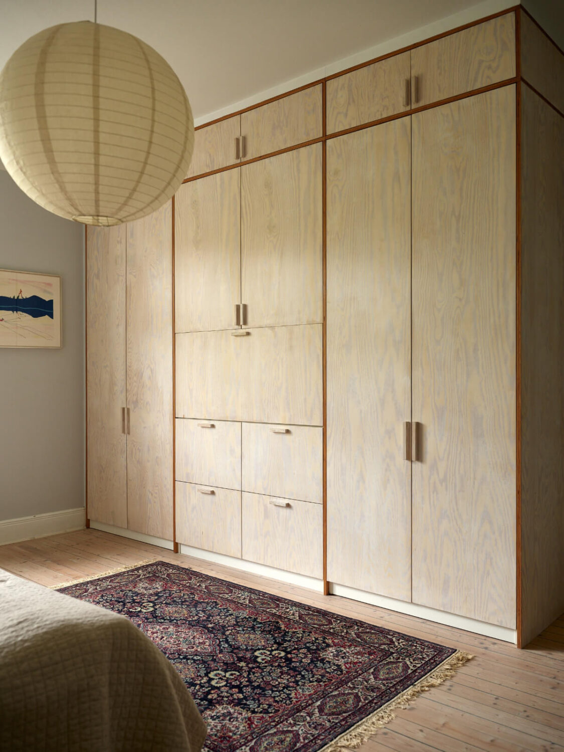 An Art Nouveau Apartment with a Deep Green Kitchen 15 wardrobe wall with folding desk