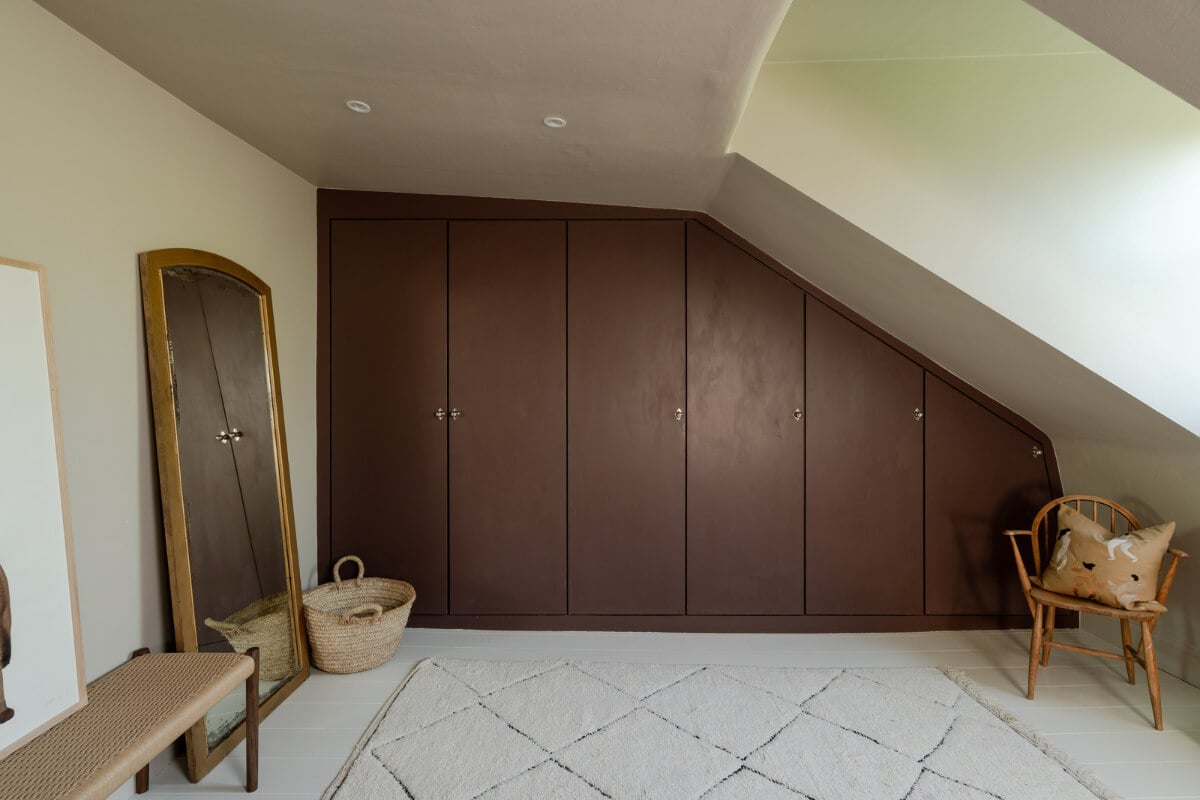 Contemporary and Classic Design in a Two-Bedroom London Duplex 15 wardrobes under slanted ceiling