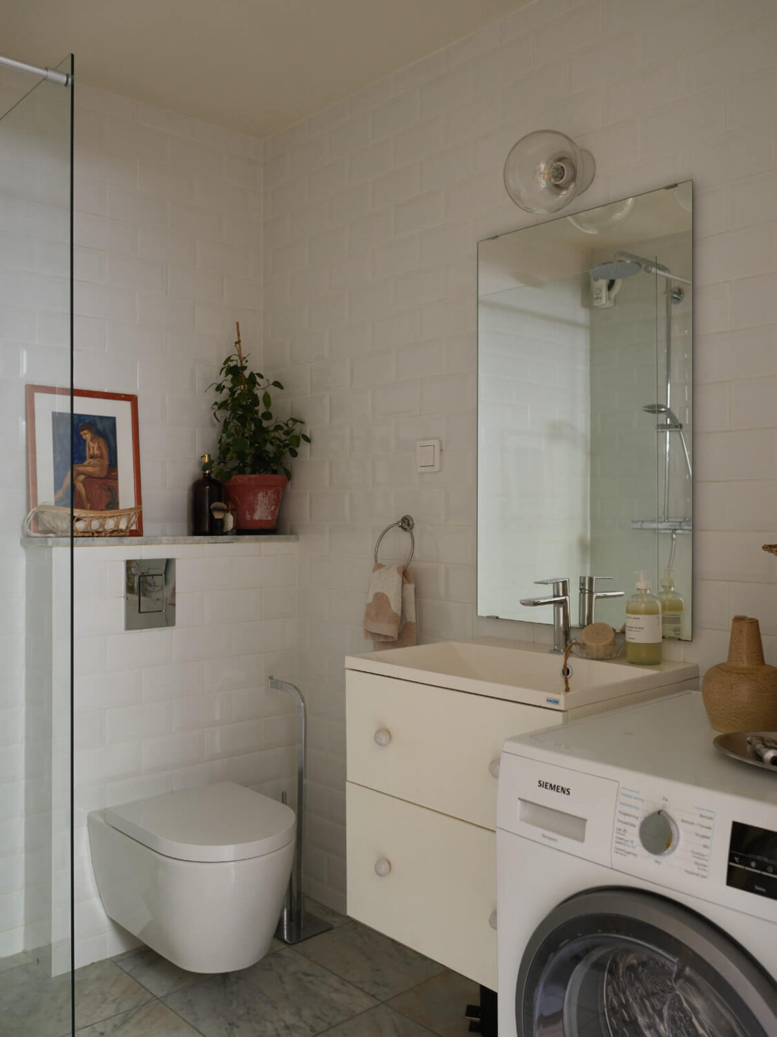 A Stylish Basement Apartment with a Private Terrace 21 white and gray bathroom