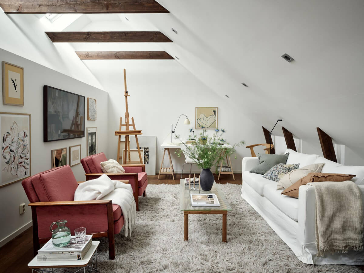 A Harmonious Color Palette in a Swedish Duplex Apartment 23 white attic living room ecposed beams skylights