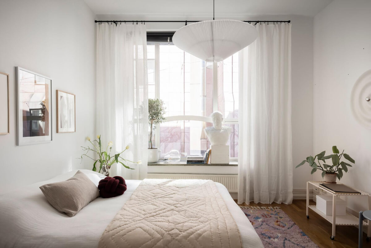 A Teal Green Living Room and Large Windows in a Swedish Apartment 18 white bedroom large windows