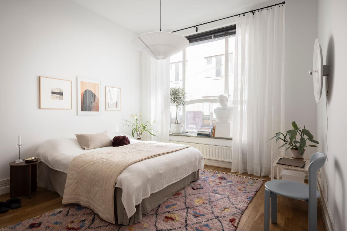 A Teal Green Living Room and Large Windows in a Swedish Apartment 16 white bedroom pastel colored rug