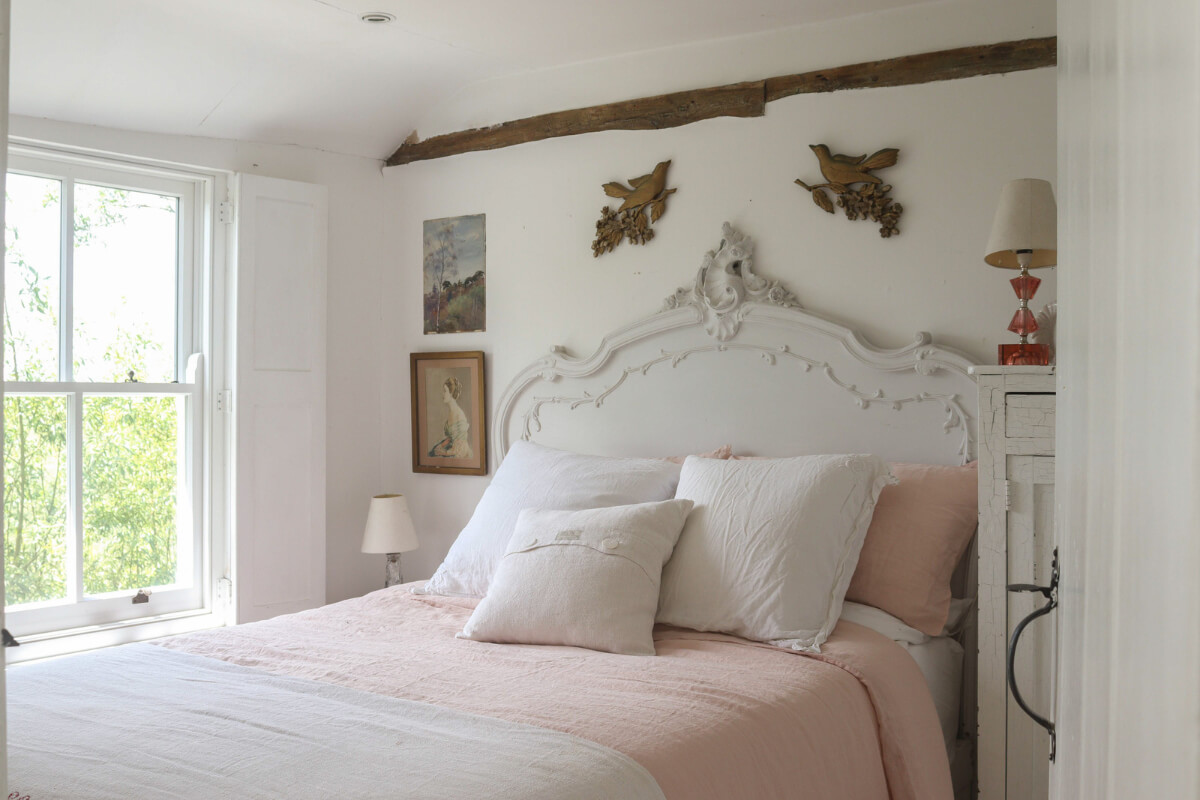 A Bright New England-Style Home with a Lush Garden 9 white bedroom