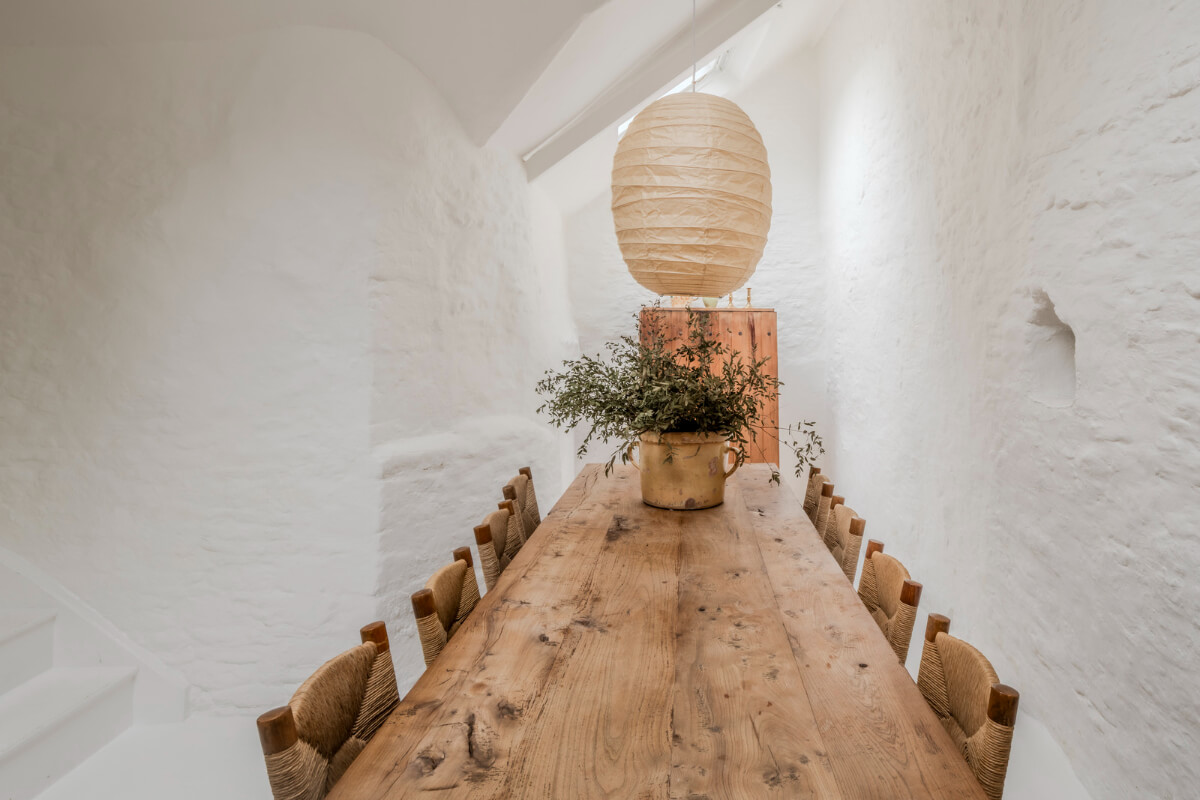White-Washed Walls and Rustic Elements in a 17th Century Townhouse 8 white dining room long wooden table