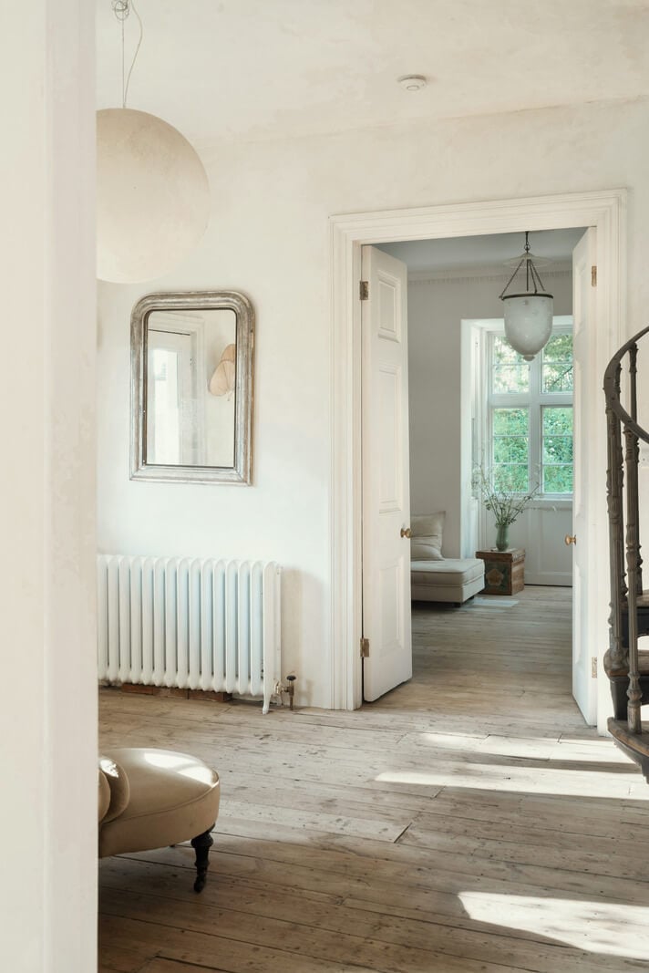 Grand, Light-Filled Spaces in a Gothic-Style English Coastal Home 10 white entry hall