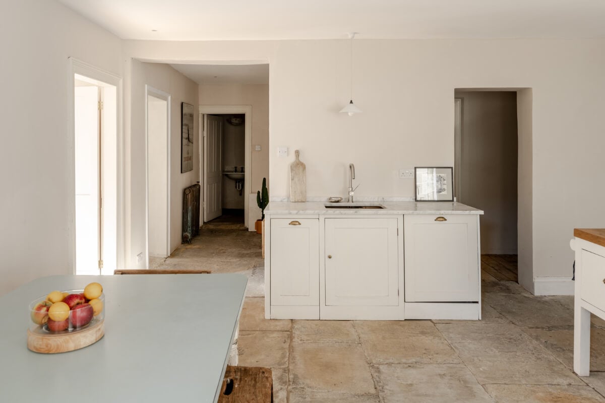 Grand, Light-Filled Spaces in a Gothic-Style English Coastal Home 24 white kitchen marble countertop