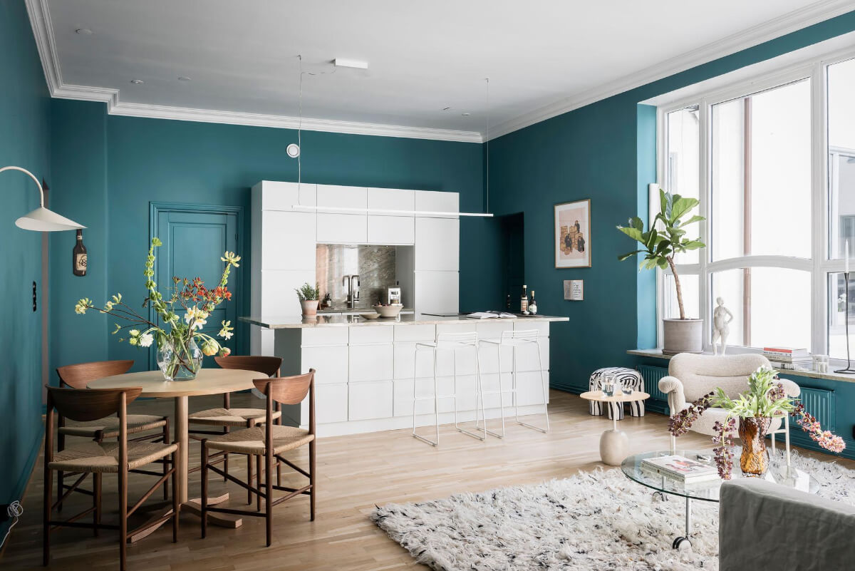 white kitchen round dining table open plan living space
