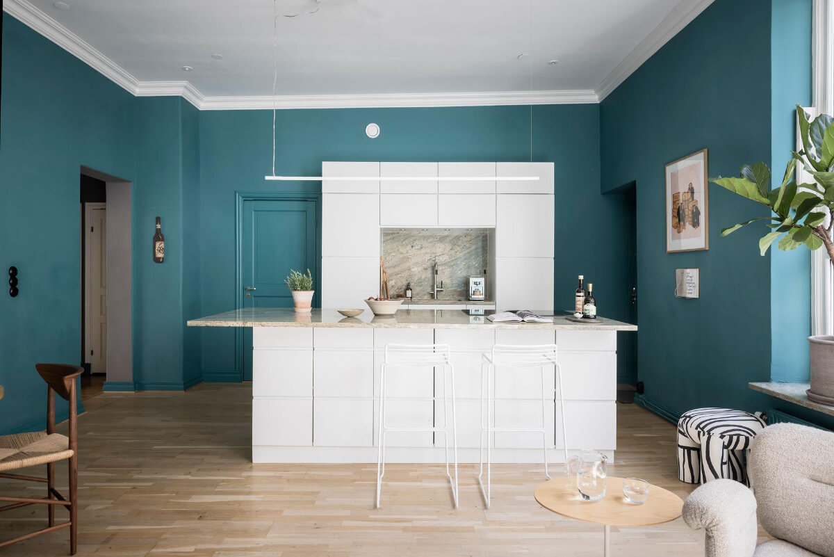 A Teal Green Living Room and Large Windows in a Swedish Apartment 10 white kitchen with island and teal green walls