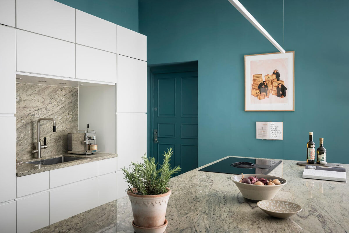 A Teal Green Living Room and Large Windows in a Swedish Apartment 12 white kitchen