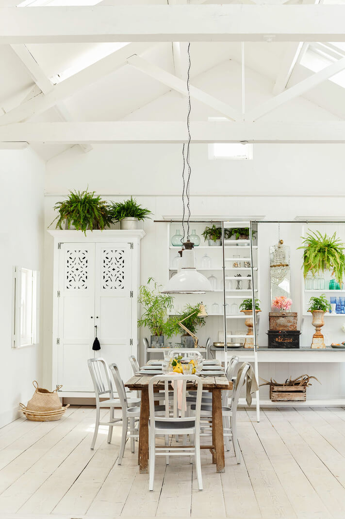 A Bright New England-Style Home with a Lush Garden 26 white pool house high pitched ceiling A Bright New England-Style Home with a Lush Garden