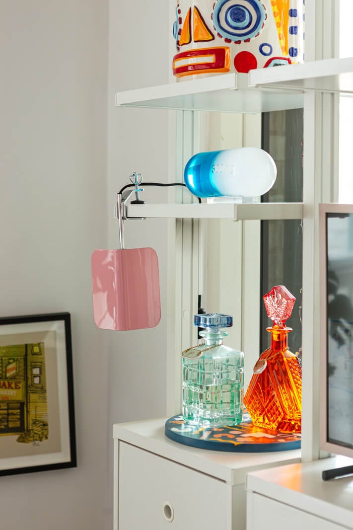 Playful Colors in a Modern One-Bedroom Apartment in London 5 white shelves detail