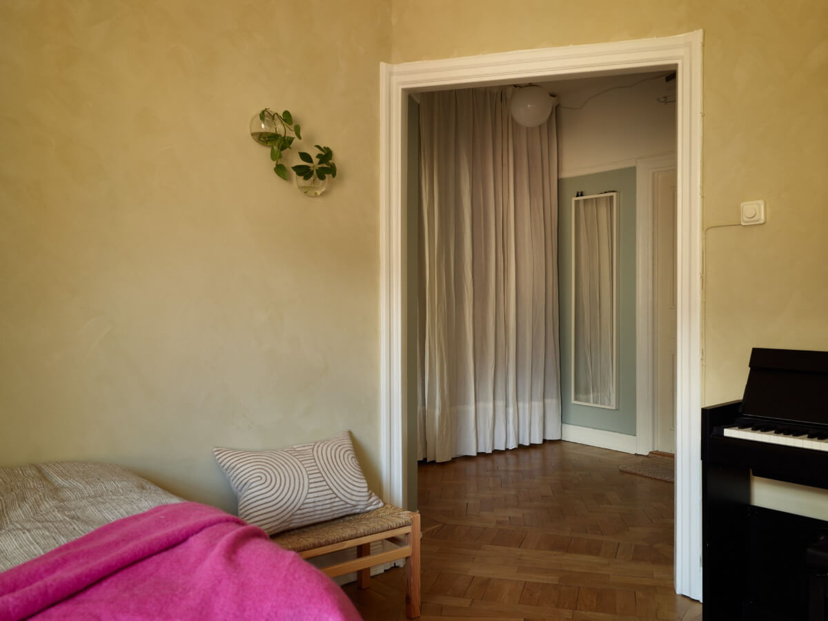 Warm Walls and Original Elements in a Swedish Studio Apartment 7 wide open doorway studio apartment