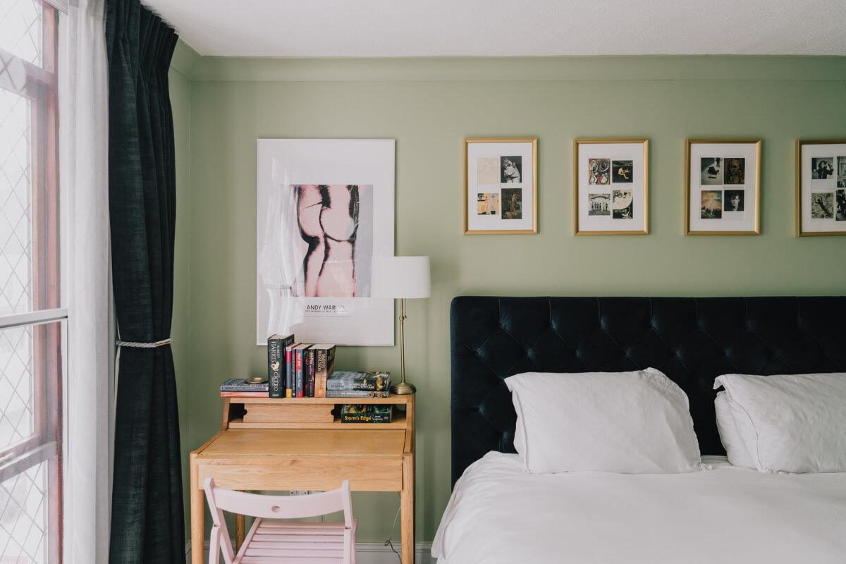 A Colorful Apartment in a Former Victorian Church in London 10 wooden desk green bedroom