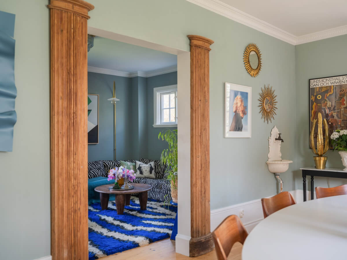 An Early 20th-Century Family Home Decorated with Color and Art 6 wooden pilars living room