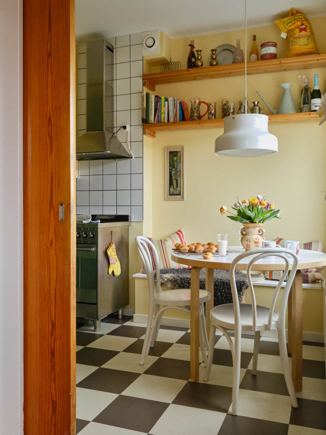 C2 Color of the Year 2026: Epernay 15 yellow walls checkerboard floor kitchen table